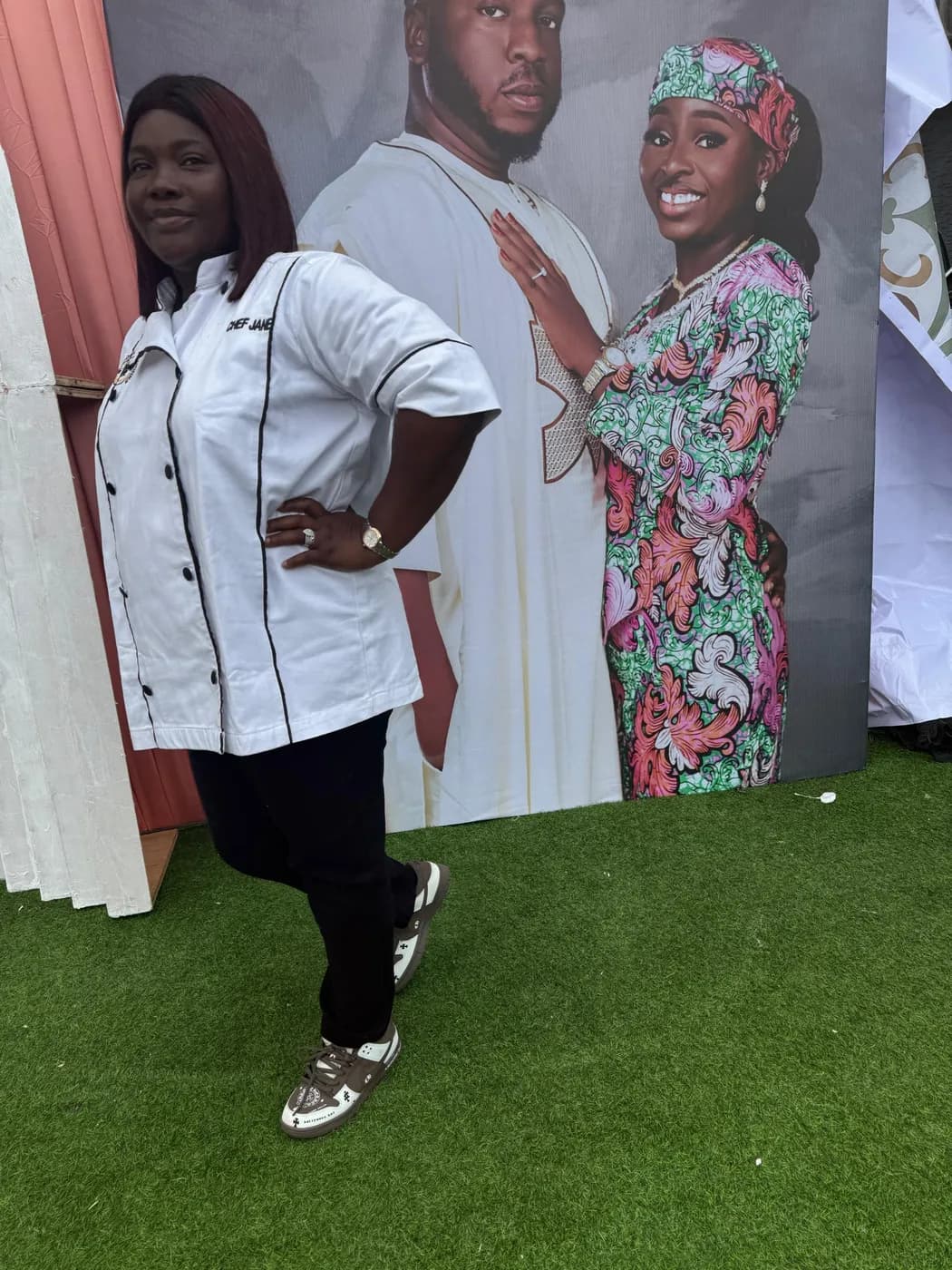 Chef Jane in her white chef jacket posing at an event