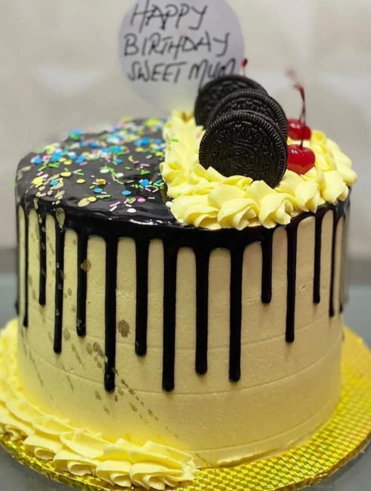Oreo drip cake with glossy chocolate coating