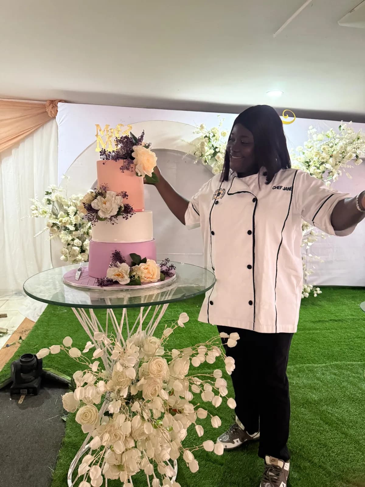 Chef carefully plating cake for event service