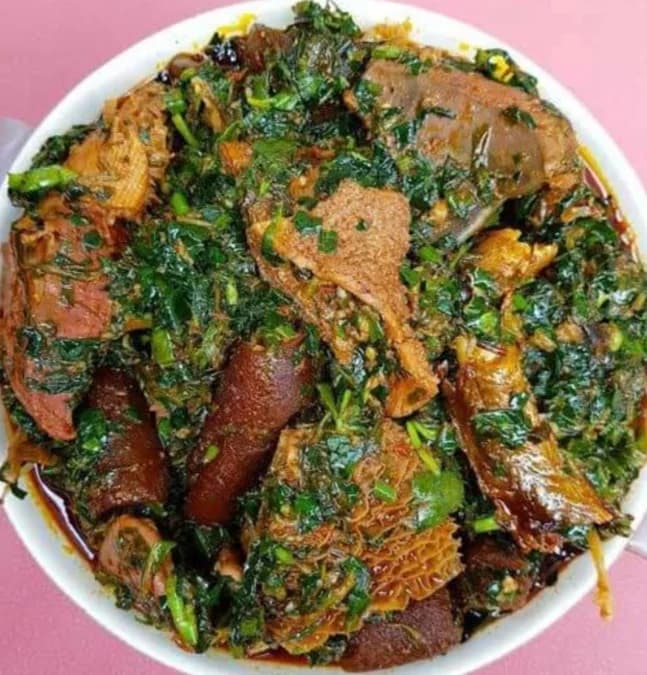 Rich efo riro stew with vibrant green vegetables and meat